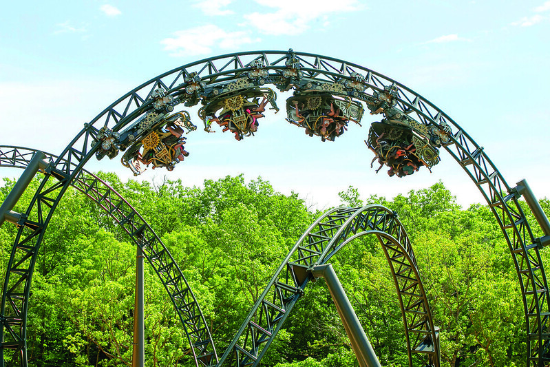 Riders inverted on the Time Traveler spinning roller coaster at Silver Dollar City in Branson, Missouri